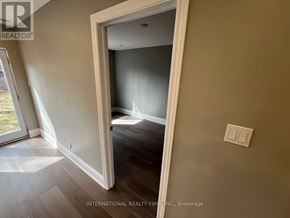 Aurora (Aurora Highlands) apartment for rent - A room with a light switch on the wall and a doorway leading to another room.