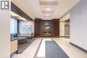 Hamilton condo for rent - A spacious living room with a couch, a chair, a coffee table, and a mirror on the wall.