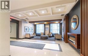 Hamilton condo for rent - A well-lit, spacious living room with a large mirror and a seating area.