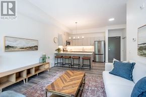 St. Thomas condo for rent - A living room with a couch, coffee table, and bar stools.