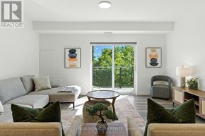 St. Thomas condo for rent - A living room with a couch, chair, and potted plant.