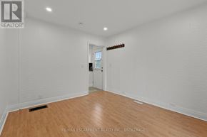 Welland (Prince Charles) multi-family for rent - A white room with a door and a brokerage sign.