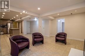 Pickering (Amberlea) apartment for rent - Three purple chairs are placed in a large, empty room.