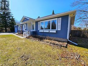 Georgina (Keswick South) apartment for rent - A blue house with a white fence and a tree in the background.