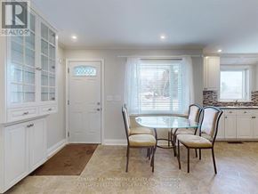 Georgina (Keswick South) apartment for rent - A dining room with a table and chairs.