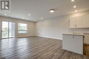 London North (North R) condo for rent - A room with wooden flooring and a white cabinet is shown.