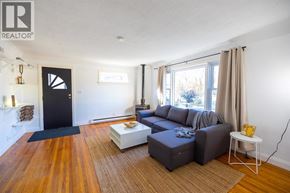 Sarnia apartment for rent - A living room with a grey couch and a coffee table.