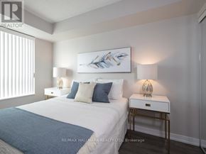 Toronto (Islington-City Centre West) condo for rent - A bedroom with a bed, nightstands, and a painting on the wall.