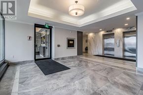 Mississauga (Meadowvale) condo for rent - A hallway with marble floors and a black door mat.