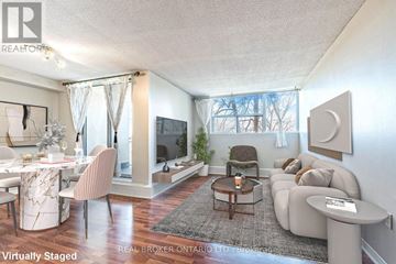 Mississauga (Meadowvale) condo for rent - A living room with a white couch and a coffee table.