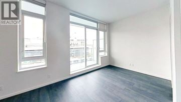 Richmond apartment for rent - A realtor's office with a large window and a wooden floor.
