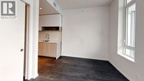 Richmond apartment for rent - A room with a wooden floor and a window on the right side.
