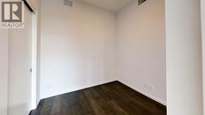 Richmond apartment for rent - A room with a wooden floor and white walls.