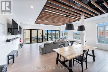 Oshawa (Samac) condo for rent - A modern living room with a wooden table and chairs.
