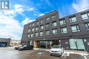 Oshawa (Samac) condo for rent - A building with the number 1800 on it and a car parked in front.