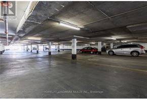 Burlington (Brant) multi-family for rent - A parking garage with a few cars parked in it.