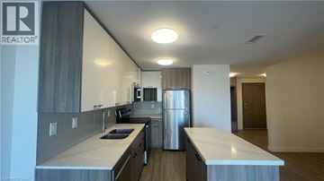 Hamilton apartment for rent - A modern kitchen with a large island in the middle.