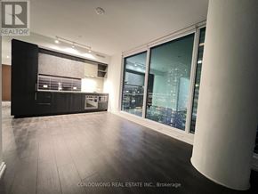 Vaughan (Vaughan Corporate Centre) condo for rent - A spacious room with a view of the city through large windows.