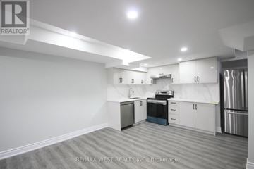 Barrie (Innis-Shore) apartment for rent - A kitchen with white cabinets and stainless steel appliances.