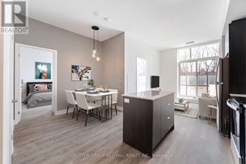 Mississauga (Mississauga Valleys) condo for rent - A modern kitchen with a dining table and chairs.