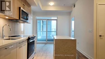 Burlington (Lasalle) condo for rent - A kitchen with a microwave and oven above the counter.