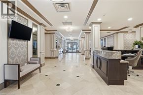 Burlington condo for rent - A well-lit, spacious lobby with a reception desk and seating area.