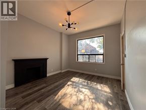 Hamilton apartment for rent - A room with a fireplace and a window.