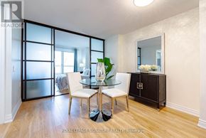 Toronto (Willowdale East) condo for rent - A dining room with a glass table and chairs.