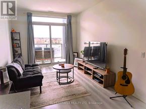 Guelph (Willow West/Sugarbush/West Acres) condo for rent - A modern kitchen with wooden cabinets and stainless steel appliances.