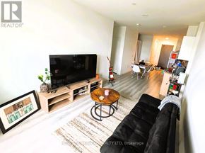 Guelph (Willow West/Sugarbush/West Acres) condo for rent - A kitchen with a black refrigerator, stove, and oven.