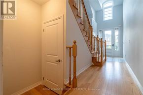 Woodstock (Woodstock - North) apartment for rent - A hallway with a white door and wooden stairs.