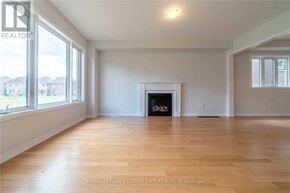 Woodstock (Woodstock - North) apartment for rent - A spacious room with a fireplace and wooden floors.