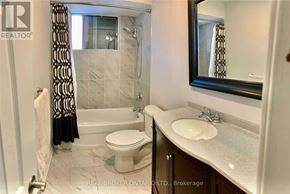 Mississauga (Applewood) apartment for rent - A bathroom with a toilet, sink, and bathtub.