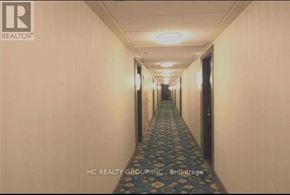 Richmond Hill (Doncrest) condo for rent - A long hallway with a carpeted floor and doors on both sides.
