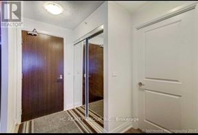 Richmond Hill (Doncrest) condo for rent - A hallway with a brown door and a white door.