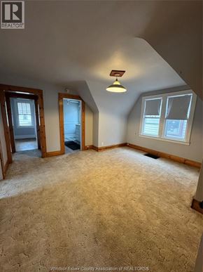 Windsor apartment for rent - A carpeted room with a skylight and a window.