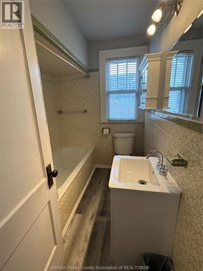 Windsor apartment for rent - A bathroom with a sink, toilet, and bathtub.