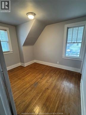 Windsor apartment for rent - A room with wooden flooring and a window.