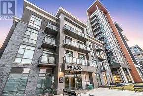 Hamilton (Waterdown) condo for rent - A modern apartment building with the name "Trend3" on the front.
