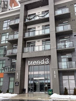 Hamilton (Waterdown) condo for rent - A large building with the word "trend3" on the front.