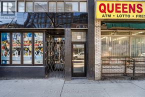 Toronto (Kensington-Chinatown) multi-family for rent - A Queens ATM, Lotto, and Fresh storefront on a city street.
