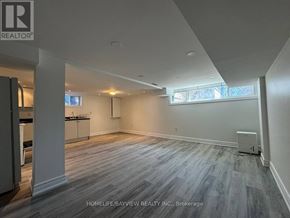 Newmarket (Bristol-London) apartment for rent - A spacious room with a grey floor and white walls.