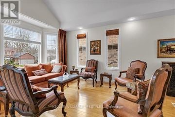 London North (North A) apartment for rent - A living room with wooden furniture and a large window.