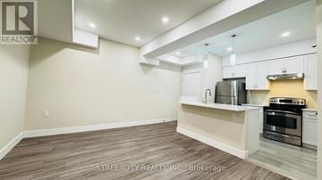 London East (East M) apartment for rent - A kitchen with white cabinets and a stainless steel oven.