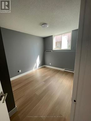 Welland (Lincoln/Crowland) multi-family for rent - A room with wooden flooring and a window.