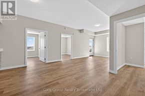 Woodstock (Woodstock - South) apartment for rent - A spacious room with wooden flooring and white walls, part of a real estate brokerage.