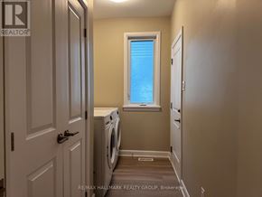 Brockville apartment for rent - A laundry room with a washer and dryer.