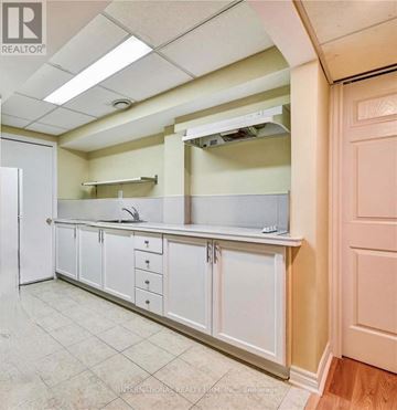 Richmond Hill (Westbrook) apartment for rent - A kitchen with white cabinets and a white refrigerator.