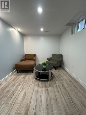 London North (North S) apartment for rent - A living room with a brown chair and a green chair with a coffee table in between.