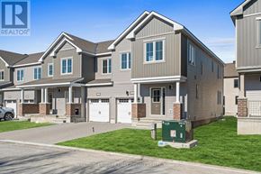 Ottawa townhouse for rent - A row of houses with a sign that says "Coldwell Banker First" in front of them.